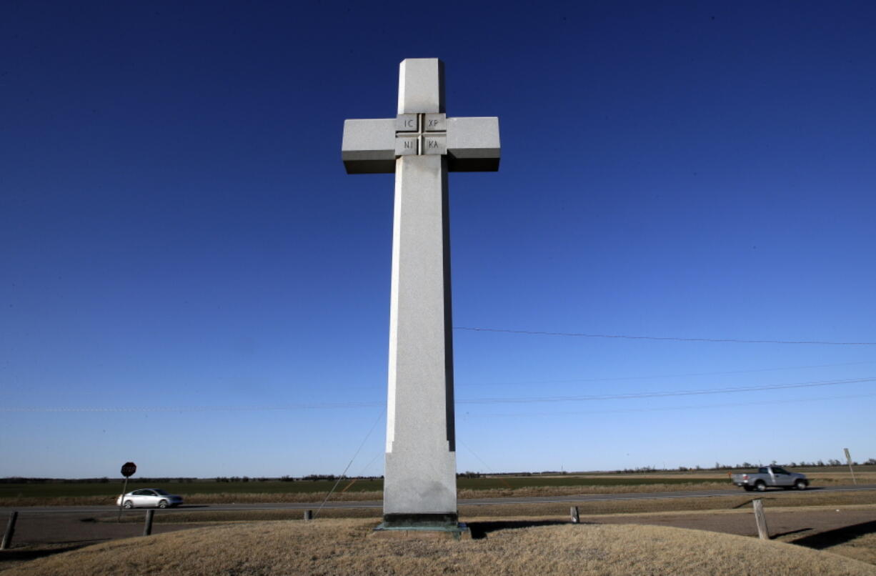 A cross, erected in memory of Fray Juan de Padilla, stands along US56 near Lyons, Kan., Tuesday, Feb. 12, 2019. The cross was a gift to the State of Kansas by the Knights of Columbus in 1950. Father Padilla traveled with Coronado and died a martyr’s death in 1542. The Supreme Court this week will hear a case challenging a nearly 100-year-old, cross-shaped Maryland war memorial.