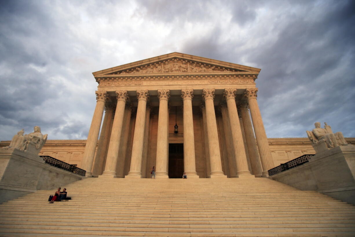 FILE - In this Oct. 18, 2018 file photo, the U.S. Supreme Court is seen at near sunset in Washington, Thursday. The Supreme Court is ending a long legal fight by ruling that a Texas death row inmate is intellectually disabled and thus may not be executed.