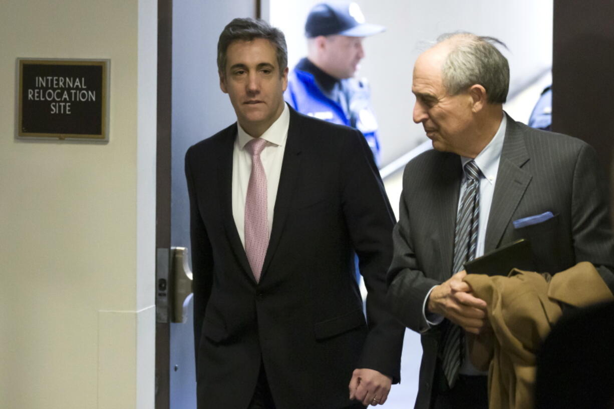 Michael Cohen, left, President Donald Trump’s former lawyer, arrives to testify before a closed door hearing of the Senate Intelligence Committee accompanied by his lawyer Lanny Davis of Washington, on Capitol Hill, Tuesday, Feb. 26, 2019, in Washington.