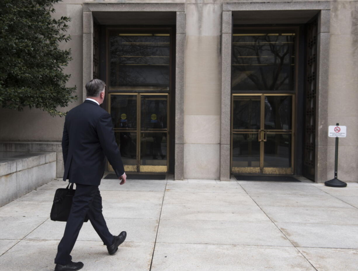 Kevin Downing, defense attorney for Paul Manafort, walks to the entrance of federal court on Wednesday, Feb. 13, 2019 in Washington.