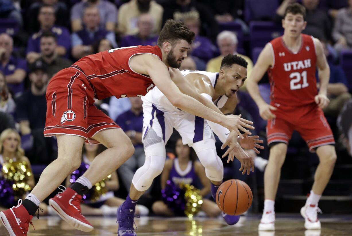 Washington's Dominic Green, center, chases a loose ball with Utah's Brandon Morley, left, as Riley Battin watches during the second half of an NCAA college basketball game Wednesday, Feb. 20, 2019, in Seattle. Washington won 62-45.