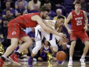 Washington's Dominic Green, center, chases a loose ball with Utah's Brandon Morley, left, as Riley Battin watches during the second half of an NCAA college basketball game Wednesday, Feb. 20, 2019, in Seattle. Washington won 62-45.