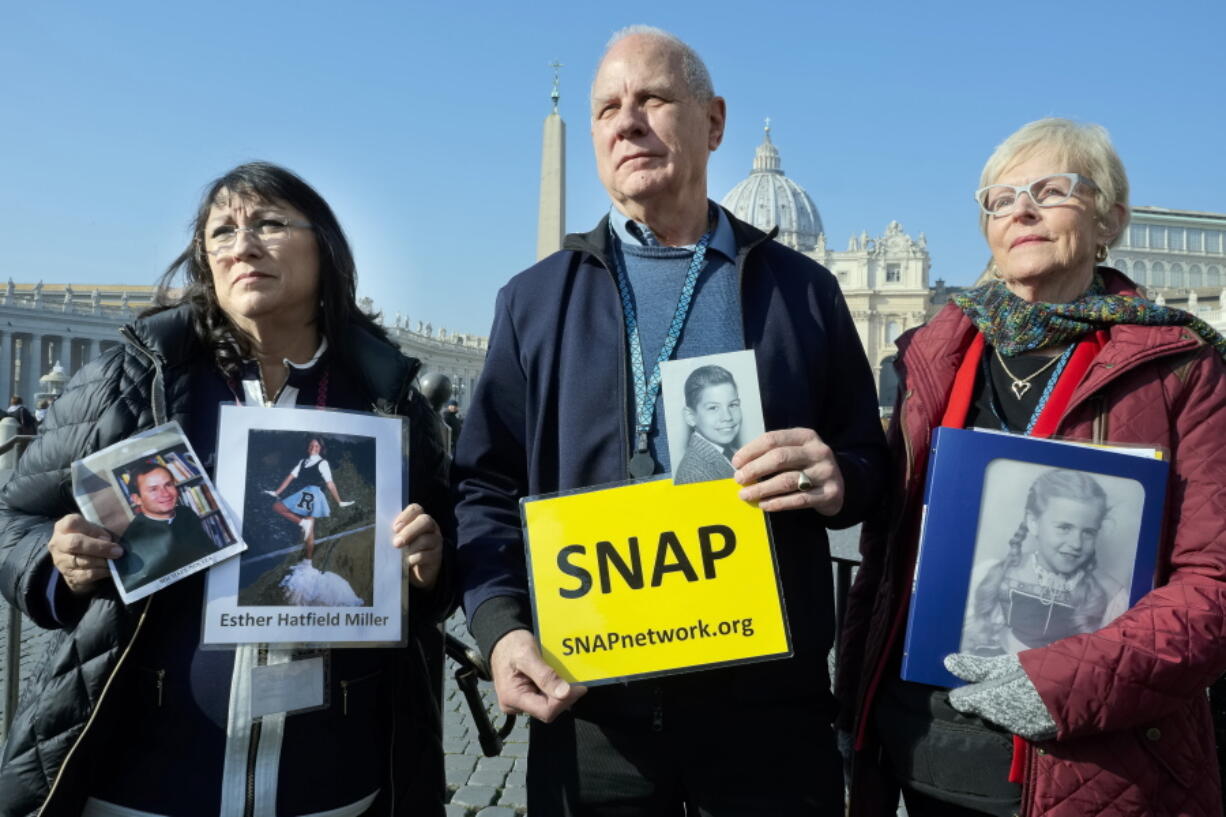 Survivors Network of those Abused by Priests members, from left, Esther Hatfield Miller of Los Angeles, SNAP President Tim Lennon of Tucson, Ariz., and Carol Midboe of Austin, Texas, meet with the media Wednesday in St. Peter’s Square at the Vatican.