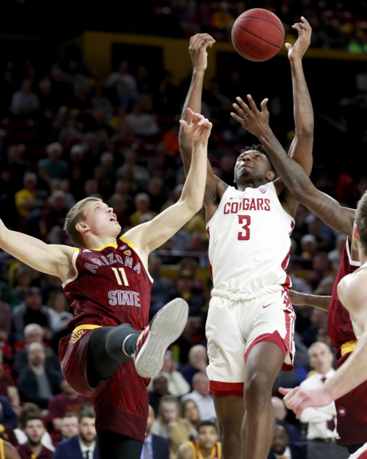 Washington State forward Robert Franks (3) and Arizona State guard Elias Valtonen (11) battle for the rebound Thursday in Tempe, Ariz. Franks, from Vancouver, matched his career high with 34 points.