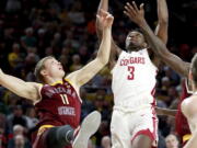 Washington State forward Robert Franks (3) and Arizona State guard Elias Valtonen (11) battle for the rebound Thursday in Tempe, Ariz. Franks, from Vancouver, matched his career high with 34 points.