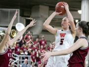 Washougal's Beyonce Bea (5), shoots over W.F. West's Courtney Bennett (21), during the WIAA 2A girls state tournament on Thursday, Feb. 28, 2019, at the Yakima Valley SunDome.