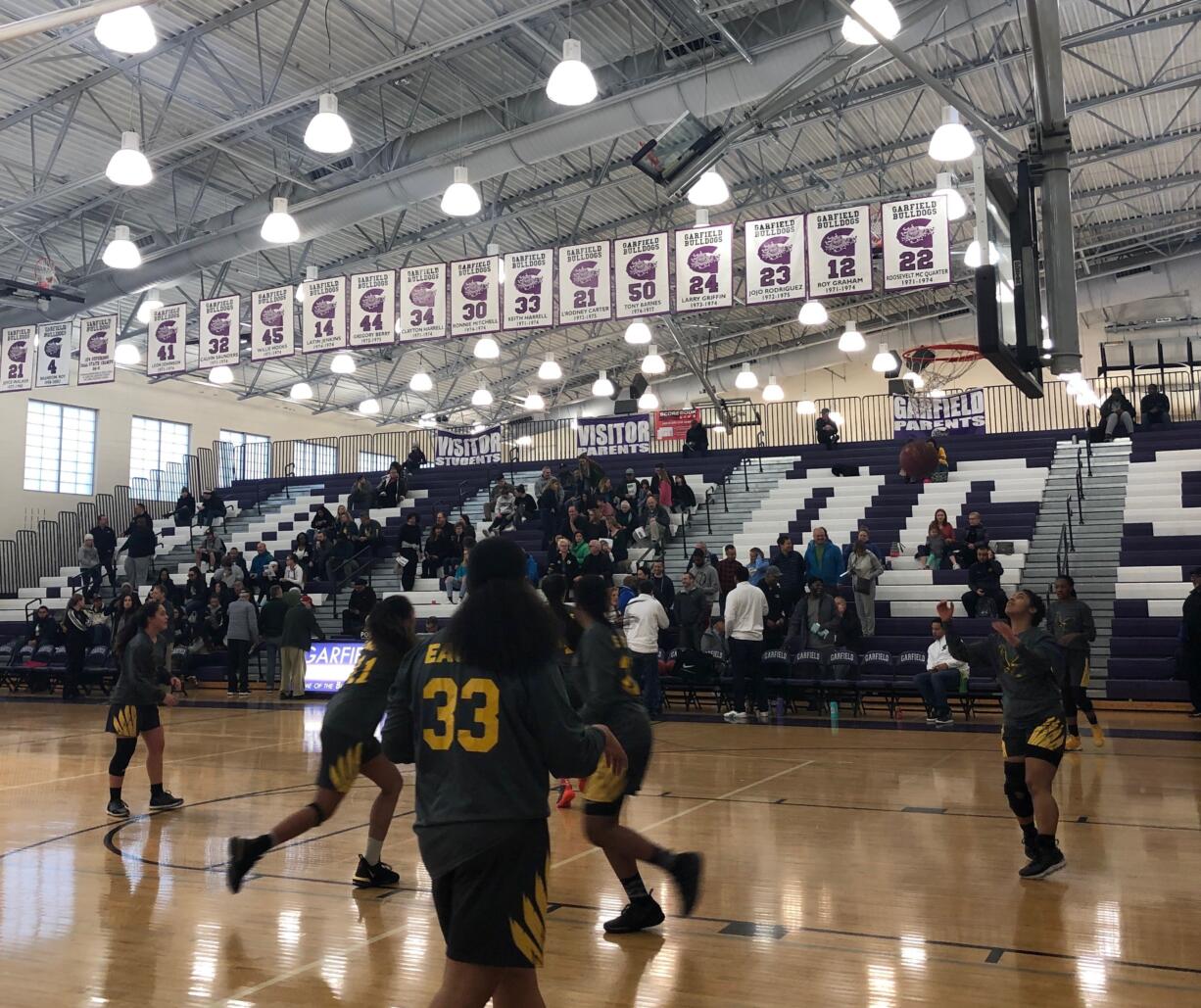 Hudson's bay girls warm up for the 3A regional round of the state tournament against Roosevelt at Garfield High School.