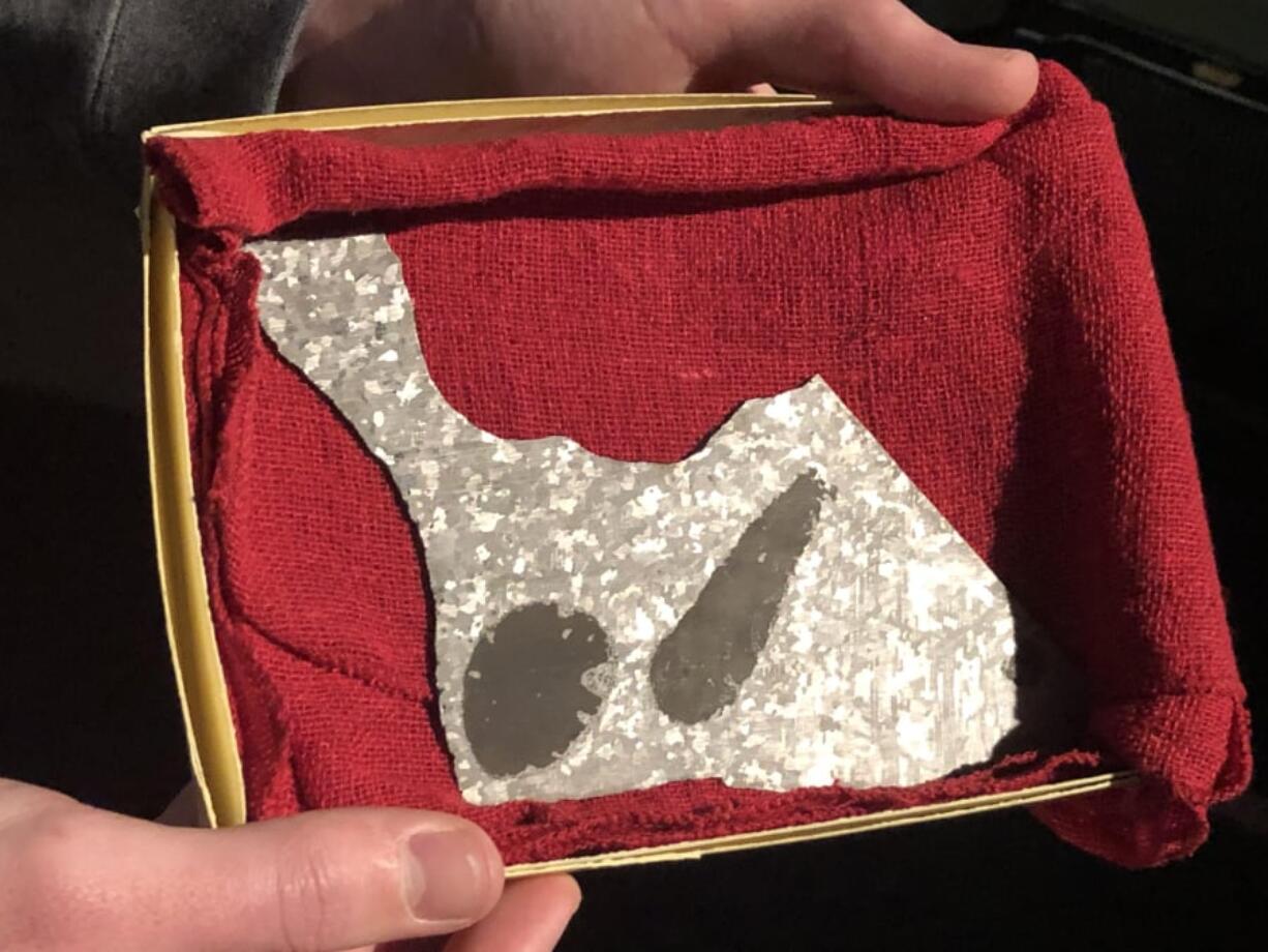 A piece of the sacred meteorite Tomanowos, also known as the Willamette meteorite. It was returned to the Confederated Tribes of Grand Ronde as a donation by the Evergreen Aviation and Space Museum.