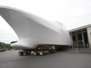 An unfinished 164-foot yacht is moved from the Christensen shipyard for transport in May 2015.