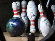 Bowling pins taking a tumble at Allen's Crosley Lanes.