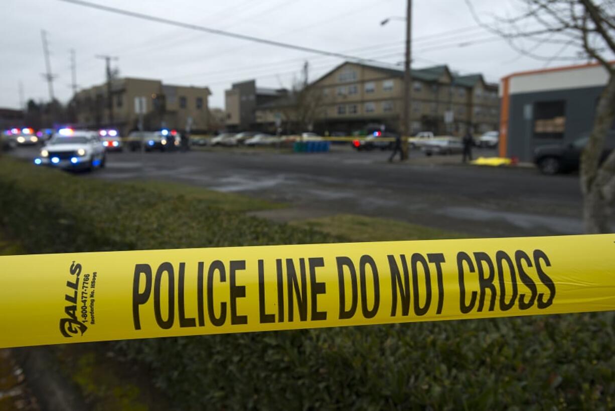 Crime scene tape surrounds the scene of a fatal officer-involved shooting Feb. 28 at West 12th and Jefferson streets in downtown Vancouver. Two Vancouver police officers shot and killed 29-year-old Michael Eugene Pierce, who was reportedly brandishing two replica firearms. The Vancouver Police Department has been involved in four shootings since Feb. 5.