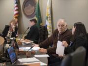 Councilor Bill Turlay speaks with Councilor Alishia Topper, right as Mayor Anne McEnerny-Ogle chats with Councilor Bart Hansen at a recent Vancouver City Council Meeting. Turlay announced Tuesday that he will not seek re-election.