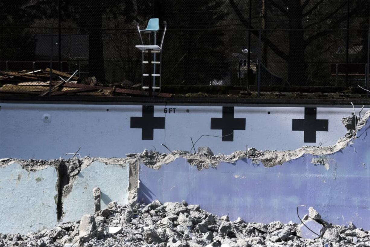 An old lifeguard chair is seen here inside the partially demolished Crown Park pool in Camas on Thursday afternoon. Demolition started this week on the pool, which opened in 1954 but hasn’t been in use since summer 2017. The work is expected to be wrapped up by April 1.