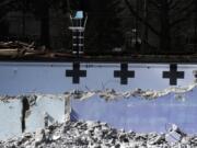 An old lifeguard chair is seen here inside the partially demolished Crown Park pool in Camas on Thursday afternoon. Demolition started this week on the pool, which opened in 1954 but hasn’t been in use since summer 2017. The work is expected to be wrapped up by April 1.