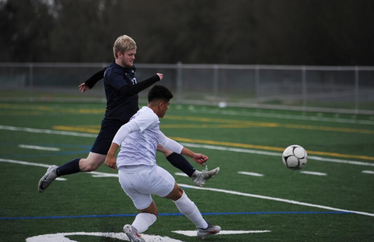 Skyview defender Karson Jones, left, tries to block a shot by Columbia River forward Aaron Espinosa during a non-league soccer match Friday at Skyview High. The teams finished in a 2-2 draw.