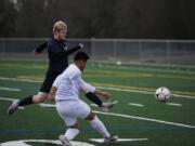 Skyview defender Karson Jones, left, tries to block a shot by Columbia River forward Aaron Espinosa during a non-league soccer match Friday at Skyview High. The teams finished in a 2-2 draw.