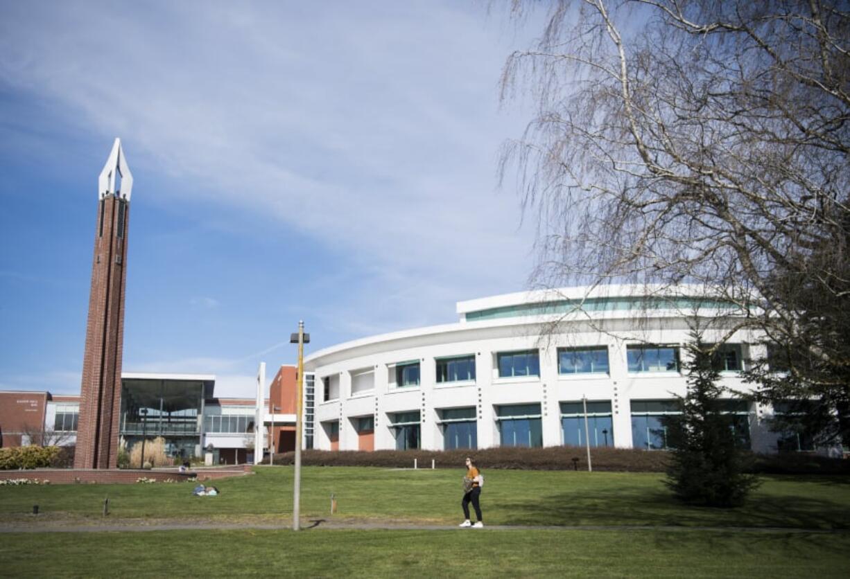 Students walk through the Clark College campus in Vancouver on March 20 during finals week.