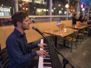 Mac Potts at home in Vancouver, playing for Friday night diners at Nom Nom Restaurant last year.