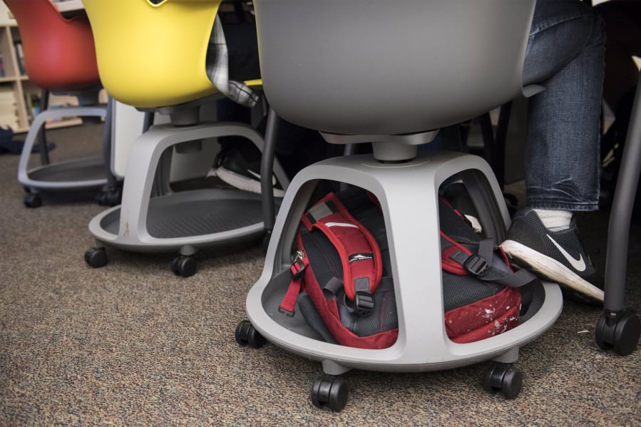 A Union High School student stores his backpack in his chair while in class Tuesday. The east Vancouver high school is testing alternative types of seating. Students say they’re able to focus more easily with the seats.