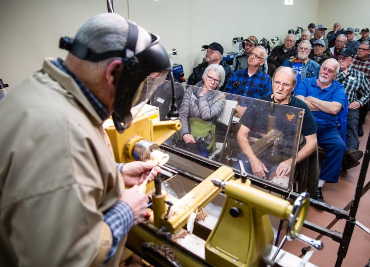 Woodturnder Brian Harte demonstrates how to make a birdhouse ornament at February’s meeting of the Southwest Washington Woodturners. The group recently took over a former day shelter for homeless people at Friends of the Carpenter, providing members with a dedicated workshop space.