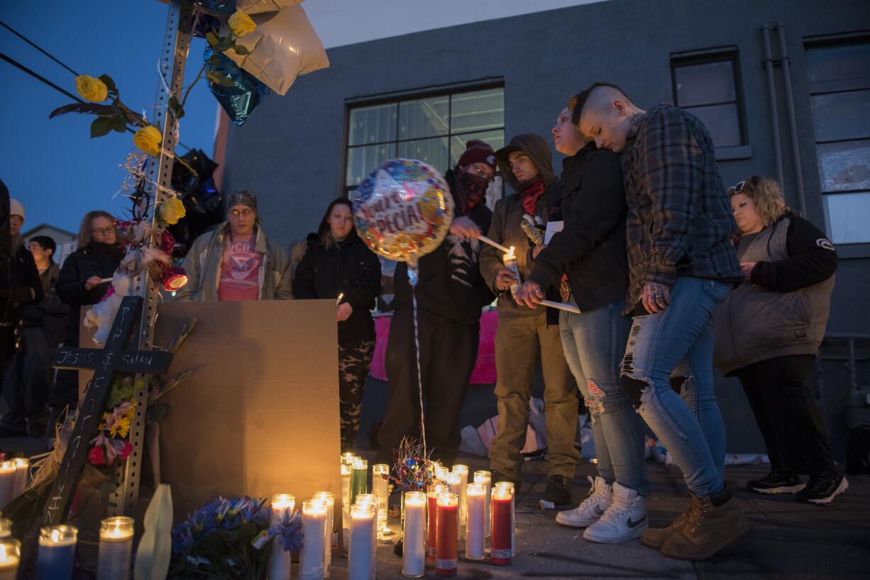 Friends and loved ones of Michael Pierce gather for an emotional candlelight vigil in his memory in downtown Vancouver on Friday evening, March 1, 2019.