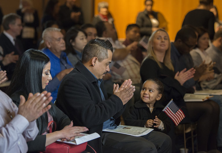 Mauricio Badillo of Vancouver, who is originally from Mexico, shares a happy moment with his daughter, Gisselle, 2, after officially becoming an American citizen during the Naturalization Ceremony at Vancouver Community Library on Thursday morning, March 7, 2019. Badillo was one of around 40 candidates from 20 countries who received their citizenship during the event. "It's a great honor to be a part of this country," he said.