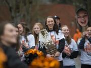 Washougal's Beyonce Bea, center, joins her teammates in celebrating the team's girls state basketball championship at Reflection Plaza in Washougal on Friday morning, March 8, 2019.