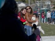 Leticia Robles and her daughters Marylu, 10, and Rebeca Rodriguez, 13, shed a few tears listening to their new neighbor and friend Paulie Villard describe the importance of their friendship. Evergreen Habitat for Humanity held a dedication Sunday of two homes in the Father Blanchet Park neighborhood.