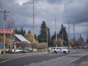 A Clark County Sheriff's cruiser blocks the road leading to the scene of a police shooting in Hazel Dell on Thursday, March 7, 2019.