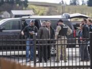 Vancouver Police officers and Clark County Sheriff's Deputies interact at the scene of a police shooting in Hazel Dell on Thursday, March 7, 2019.