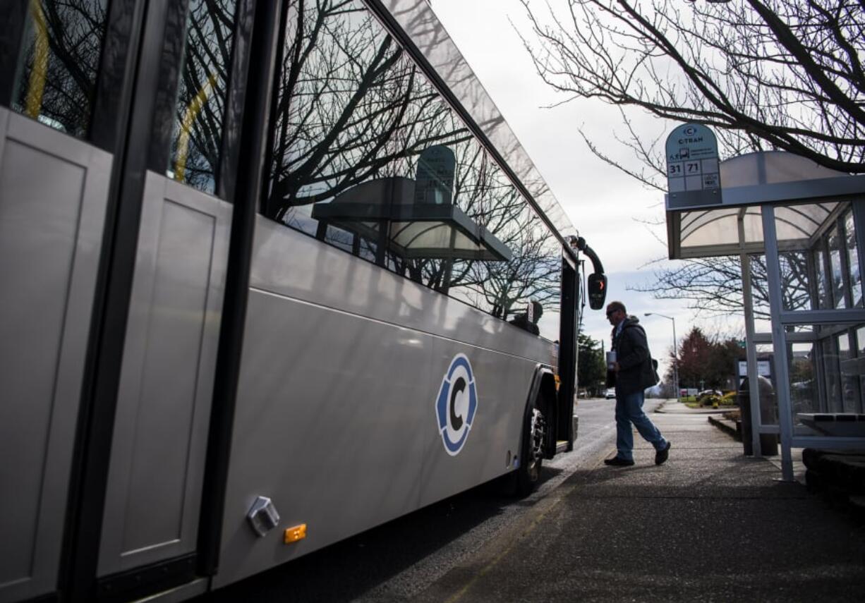 Roy Garvie of Vancouver gets on the C-Tran bus across the street from Safeway on Main Street in Vancouver.