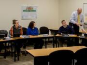 Woodland: Woodland Superintendent Michael Green, standing, presents each school board member with a certificate honoring their service. The board members are, from left, Janice Watts, Sarah Stuart, Lesa Beuscher, Matt Donald and Steve Madsen.