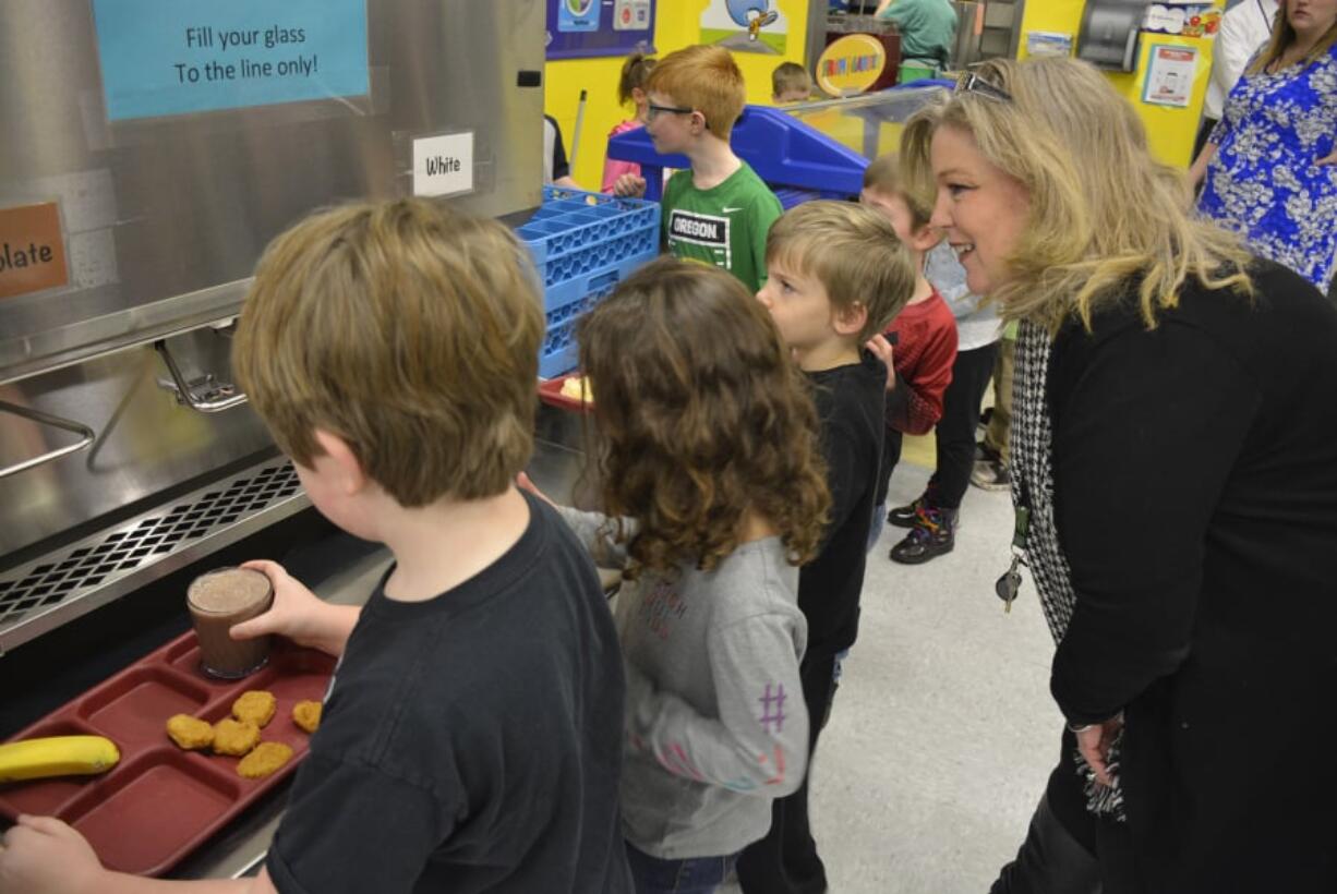 Washougal: Gause Elementary School Principal Tami Culp and students check out the school’s new milk dispenser, which was brought in to help reduce food and packaging waste.