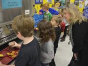 Washougal: Gause Elementary School Principal Tami Culp and students check out the school’s new milk dispenser, which was brought in to help reduce food and packaging waste.