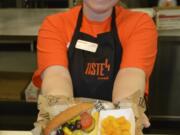 Washougal: Pam Spangenbert presents a sandwich courtesy of Taste4, a new lunch program from Sodexo being used at Washougal High School, which aims to give students more cafeteria options.