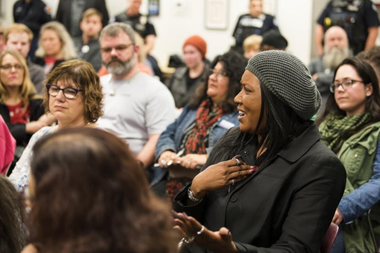 Ophelia Noble, executive director of The Noble Foundation, speaks with Vancouver Police Chief James McElvain about the recent officer-involved shootings and the amount of shootings involving people of color during a Vancouver Neighborhood Alliance meeting Wednesday night at Fisher’s Landing Fire Station 9 in Vancouver.