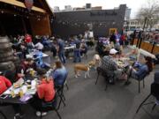 Patrons crowd the patio Saturday at Heathen Brewing Feral Public House during the dog-friendly Yappy Hour, which raised money for the Humane Society for Southwest Washington.