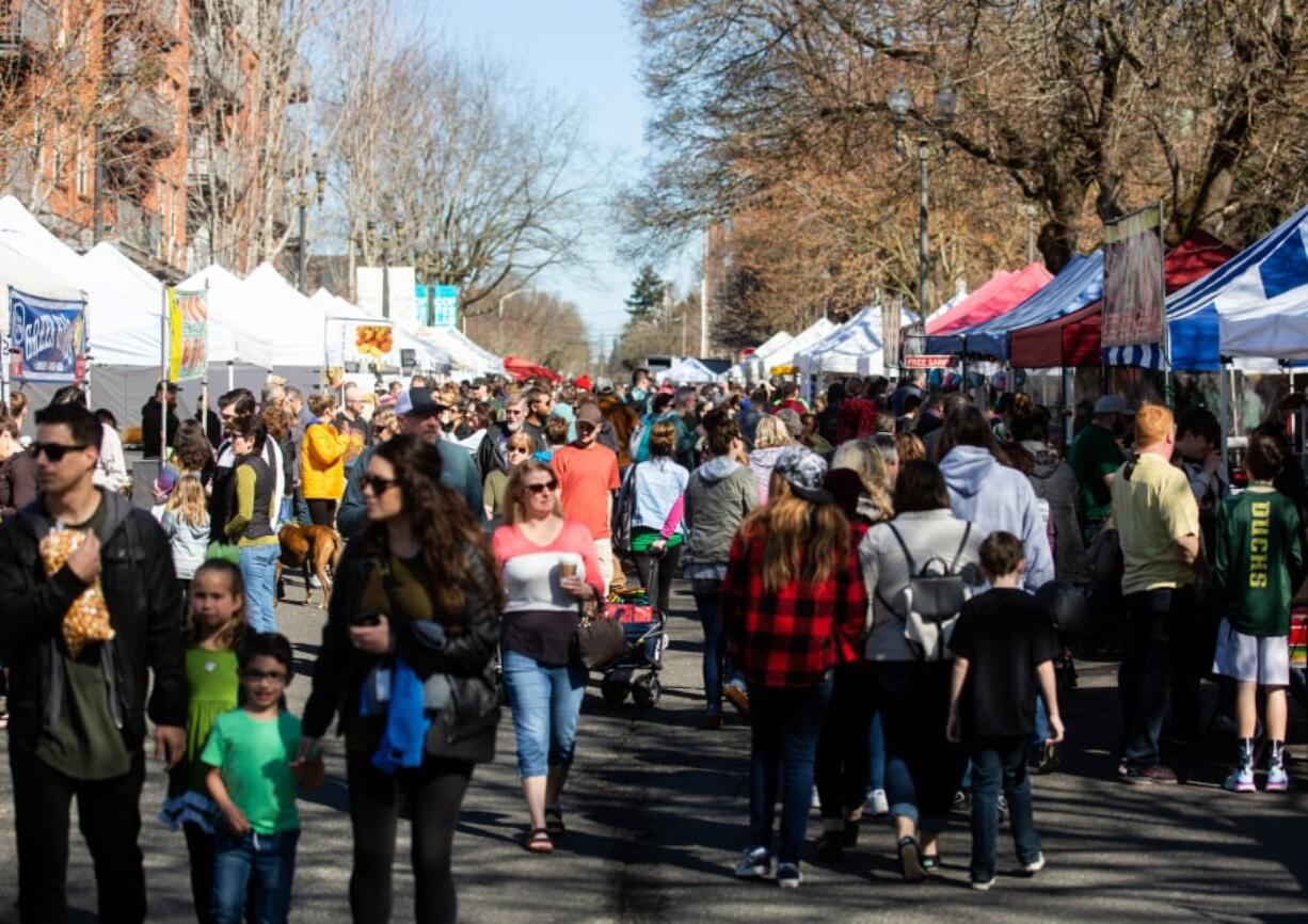 People gather Sunday for the opening weekend of the Vancouver Farmers Market.