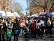 People gather Sunday for the opening weekend of the Vancouver Farmers Market.