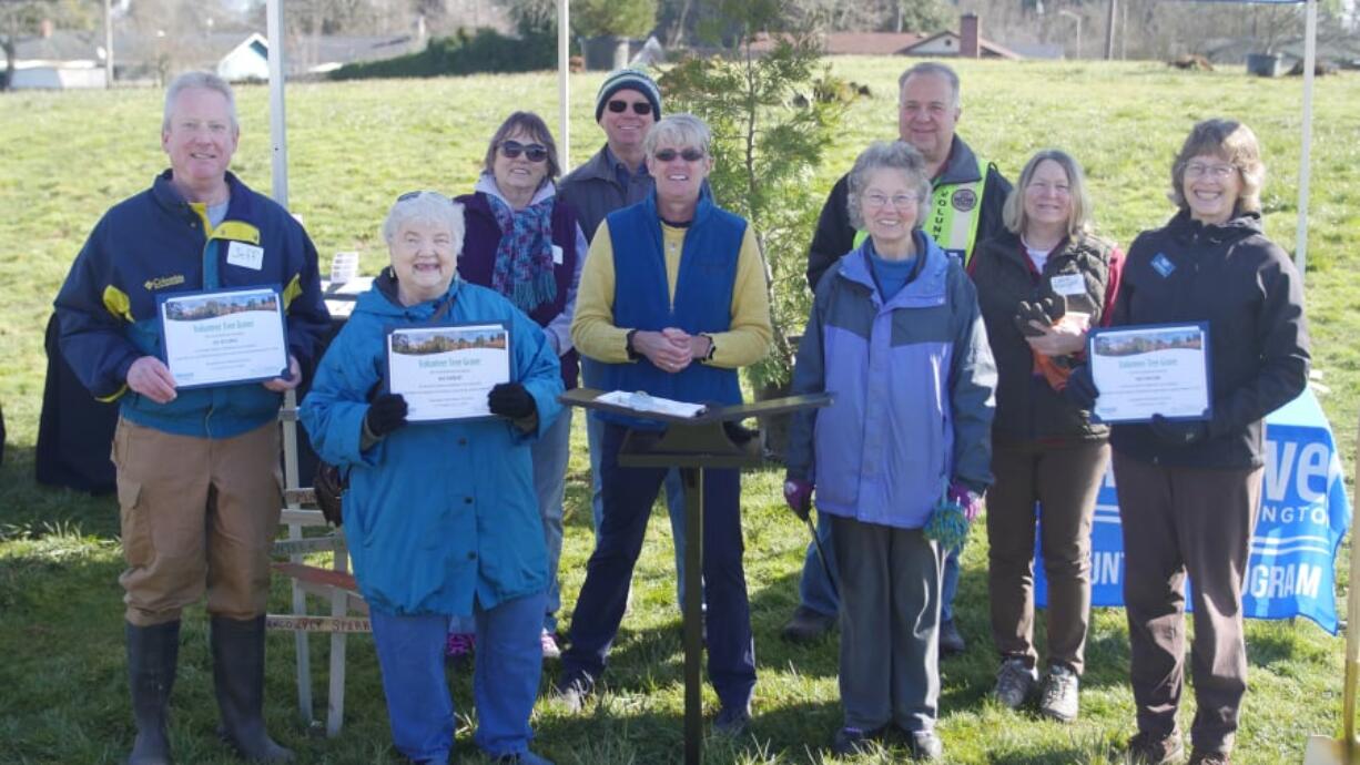 Nine volunteers were recognized with tree plantings.