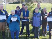 Nine volunteers were recognized with tree plantings.