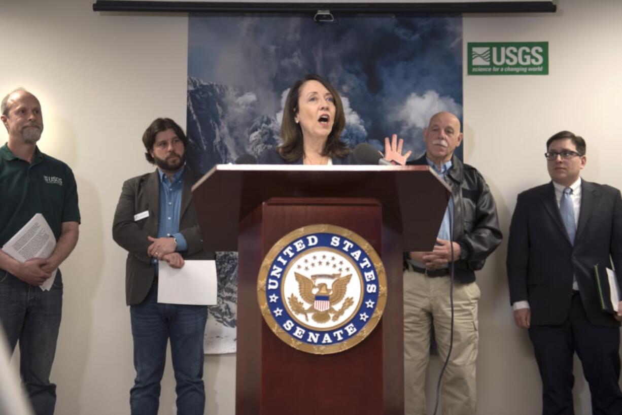 Seth Moran, scientist-in-charge at the U.S. Geological Survey Cascades Volcano Observatory, from left, Ray Yurkewycz, executive director of the Mount St. Helens Institute, U.S. Sen. Maria Cantwell, D-Wash., Ernie Schnabler, director of emergency management with the Cowlitz County Sheriff’s Office, and Dan Douthit, public information officer for the Portland Bureau of Emergency Communications, talk about the importance of volcano monitoring prior to a tour at the CVO on Thursday morning.