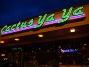 Cactus Ya Ya’s neon sign shines in east Vancouver on a recent Friday night. The restaurant replaced a Minit Mart 25 years ago in what was once Vancouver’s rural eastern frontier. “The first couple years were a little spooky,” said owner Jim Rettig.