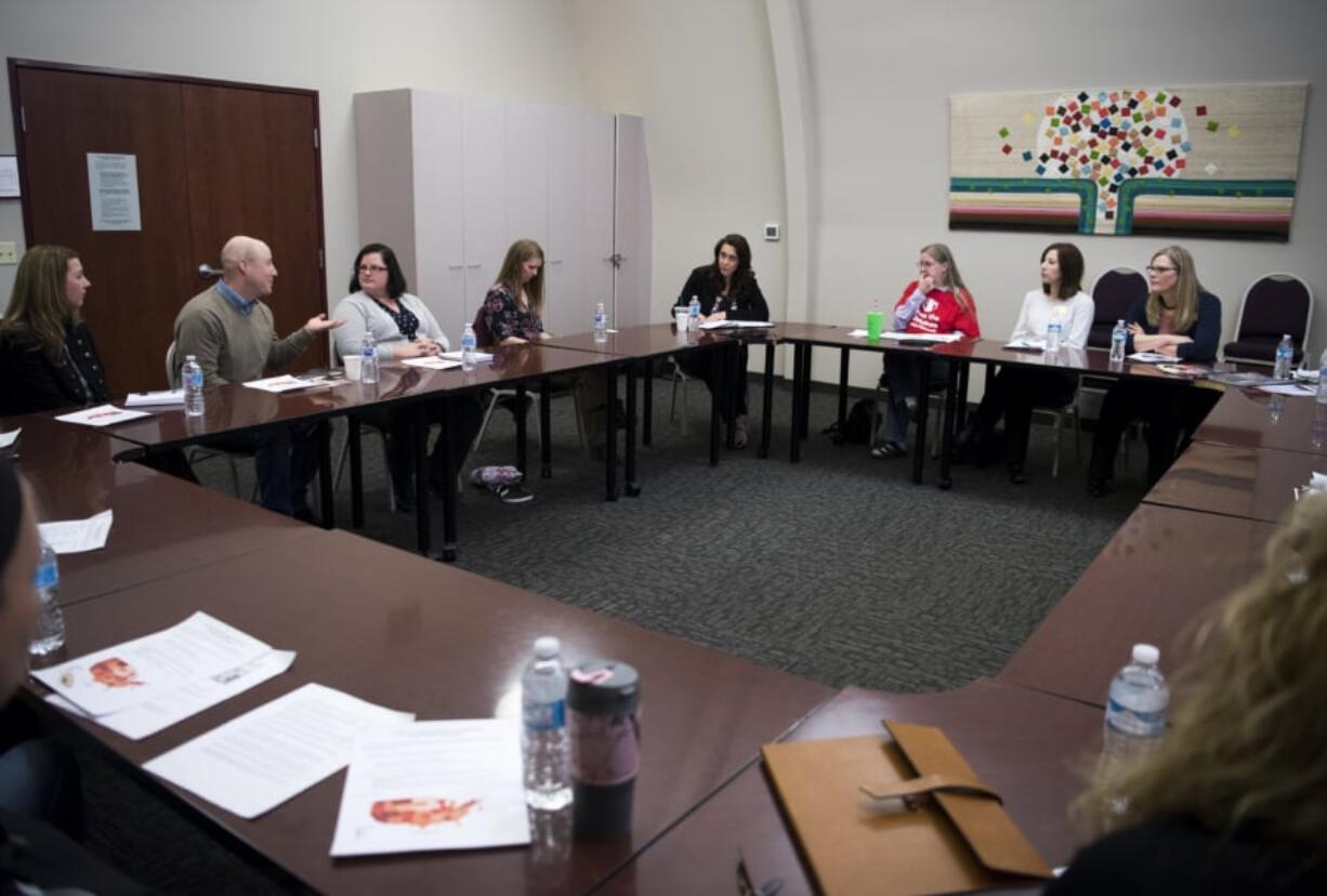 U.S. Rep. Jaime Herrera Beutler, R-Battle Ground, center, speaks with parents and child care providers during an open forum discussion at YWCA Clark County in Vancouver on Tuesday morning. The congresswoman recently co-sponsored a bill that would ease “child care deserts” where young children outnumber availability in child care programs.