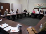 U.S. Rep. Jaime Herrera Beutler, R-Battle Ground, center, speaks with parents and child care providers during an open forum discussion at YWCA Clark County in Vancouver on Tuesday morning. The congresswoman recently co-sponsored a bill that would ease “child care deserts” where young children outnumber availability in child care programs.