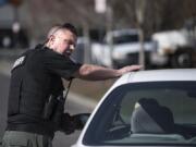 Clark County sheriff’s Sgt. Alex Schoening speaks to a driver after pulling her over for expired tabs during a Target Zero patrol emphasis Wednesday in Hazel Dell.