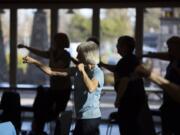 Millie Wilkins of Battle Ground gets her heart rate up while working out during an EnhanceFitness class at Battle Ground Community Center.