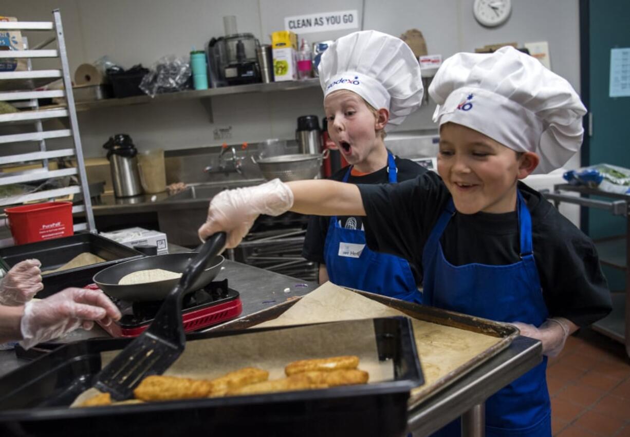 Pleasant Valley Primary School third-grader Henry Blickenstaff, left, and Captain Strong Elementary School third-grader Noah Ruotsalainen prepare fish tacos for the annual Sodexo Future Chefs Competition hosted by Battle Ground High School on Thursday. The chef of the winning recipe will go on to a regional competition, and potentially on to the national cook-off.