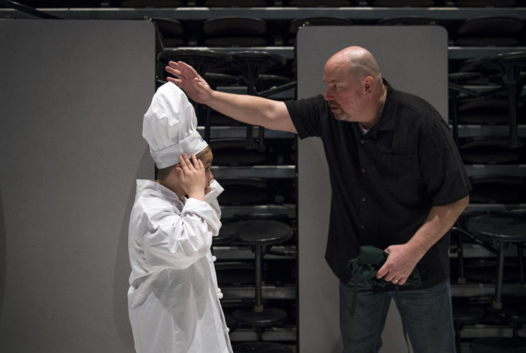 Captain Strong fourth-grader Colton Diamond, left, checks his chef outfit with his father Jack during the annual Sodexo Future Chefs Competition hosted by Battle Ground High School on March 21, 2019. The chef of the winning recipe will go on to a regional competition, and potentially on to the national cookoff.