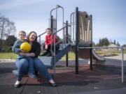 Chance Milgrove, 6, sits in his mother Caressa Milgrove’s lap near their home. Her oldest son, 8-year-old Mark, long complained to Milgrove that lunch was too short for him to finish all of his food. The family has been pushing for longer lunch sessions at schools locally and across the state.